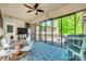 A screened porch with a geometric patterned rug and a ceiling fan at 1540 Neely Store Rd, Rock Hill, SC 29730