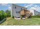 Large backyard boasts a deck and patio, offering multiple spaces for outdoor entertaining and relaxation at 17231 Rider Wood Ln, Charlotte, NC 28278