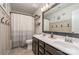 Stylish bathroom featuring a double sink vanity, modern fixtures, and decorative accents at 17231 Rider Wood Ln, Charlotte, NC 28278