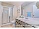 Stylish bathroom features a glass enclosed shower and sleek white fixtures for a clean look at 17231 Rider Wood Ln, Charlotte, NC 28278