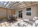 A cozy deck with a pergola, dining set, and cushioned lounge chairs offers a relaxing outdoor space at 17231 Rider Wood Ln, Charlotte, NC 28278