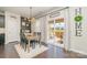 Cozy dining area featuring a table for four, access to the deck, and modern light fixtures at 17231 Rider Wood Ln, Charlotte, NC 28278