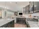 Modern kitchen featuring granite countertops, stainless steel appliances, and dark wood cabinetry at 17231 Rider Wood Ln, Charlotte, NC 28278