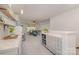 Open floor plan with cozy living area and a breakfast bar with modern appliances at 17231 Rider Wood Ln, Charlotte, NC 28278