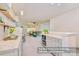 Open concept living area with kitchenette and plenty of natural light for a comfortable space at 17231 Rider Wood Ln, Charlotte, NC 28278