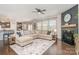 Spacious living room boasts a fireplace, large sectional sofa, and seamless connection to the kitchen at 17231 Rider Wood Ln, Charlotte, NC 28278