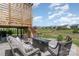 A backyard patio with a modern fire pit and comfortable seating is ideal for gatherings and relaxation at 17231 Rider Wood Ln, Charlotte, NC 28278