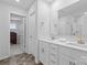 Modern bathroom featuring a double sink vanity, large mirror, and neutral finishes at 179 Bezelle Ave # 34, York, SC 29745