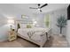 Inviting bedroom showcasing a large bed, bedside tables with lamps, and a charming green color palette at 179 Bezelle Ave # 34, York, SC 29745