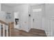 Bright entryway featuring wood-look floors and white wainscoting leading to additional rooms at 179 Bezelle Ave # 34, York, SC 29745