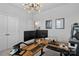 Spacious office featuring a modern chandelier, dual monitors, and organized decor for productive work at 179 Bezelle Ave # 34, York, SC 29745