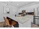 The modern kitchen boasts a granite island, stainless steel appliances, and white cabinets with black hardware at 179 Bezelle Ave # 34, York, SC 29745