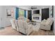 A living room boasts a fireplace, a modern ceiling fan, and natural lighting at 179 Bezelle Ave # 34, York, SC 29745