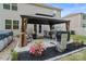 Outdoor patio with gazebo, dining table, chairs, grill and manicured landscaping at 179 Bezelle Ave # 34, York, SC 29745