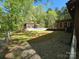 View of pool house, deck, and stone landscaping from the backyard of the property at 1855 7Th St, Salisbury, NC 28144