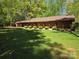 Lovely single-story home with a well-manicured front yard and lush green lawn on a bright, sunny day at 1855 7Th St, Salisbury, NC 28144