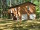Garage building featuring an upstairs living space with a private entry and two garage doors at 1855 7Th St, Salisbury, NC 28144
