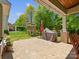 Landscaped backyard with stone patio, swingset and covered grill at 2002 Potomac Rd, Indian Trail, NC 28079