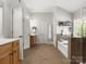 Bathroom featuring double vanities, a separate shower, and soaking tub at 2002 Potomac Rd, Indian Trail, NC 28079