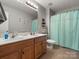 Bathroom with double sinks, modern vanity, and ample lighting at 2002 Potomac Rd, Indian Trail, NC 28079