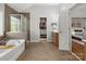 Bathroom featuring a separate shower, soaking tub, and walk in closet at 2002 Potomac Rd, Indian Trail, NC 28079