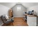 Bright home office with wood floors, built-in shelves, and a large window at 2002 Potomac Rd, Indian Trail, NC 28079