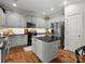 Spacious kitchen with stainless steel appliances, center island and granite countertops at 2002 Potomac Rd, Indian Trail, NC 28079