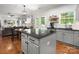 Open kitchen flows to living room with stainless appliances, granite countertops and eat-in breakfast nook at 2002 Potomac Rd, Indian Trail, NC 28079