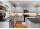 Modern kitchen with stainless steel appliances, granite countertops, and hardwood flooring at 2002 Potomac Rd, Indian Trail, NC 28079