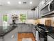 Open kitchen with stainless steel appliances, granite countertops, and hardwood flooring at 2002 Potomac Rd, Indian Trail, NC 28079