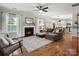 Cozy living room with a fireplace, comfortable seating, and an open concept layout at 2002 Potomac Rd, Indian Trail, NC 28079