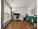 Bright and airy office space with wood floors, a large window, and modern furniture at 2002 Potomac Rd, Indian Trail, NC 28079