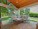 Covered patio with comfortable seating area, perfect for outdoor entertaining at 2002 Potomac Rd, Indian Trail, NC 28079