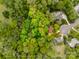 An aerial view of a home in a densely wooded lot with a red line marking property limits at 2199 Lookout Pt, Rock Hill, SC 29732