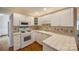 Bright kitchen with white cabinets, tiled countertops, and functional layout at 2199 Lookout Pt, Rock Hill, SC 29732