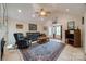 Open living room with vaulted ceilings, tile flooring, and comfortable seating arrangement at 2199 Lookout Pt, Rock Hill, SC 29732