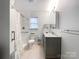 Bright bathroom featuring a granite countertop vanity, subway tile in the shower, and modern fixtures at 2214 Cannonade Ct, Matthews, NC 28105