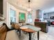Charming breakfast nook featuring a cozy bench, a wooden table, and a stained glass window with natural light at 2214 Cannonade Ct, Matthews, NC 28105