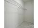 Walk-in closet with wire shelving and neutral walls providing ample storage space at 307 E 2Nd St, Lowell, NC 28098