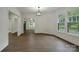 Spacious living area with hardwood floors, large windows, and views into other rooms, perfect for entertaining at 307 E 2Nd St, Lowell, NC 28098