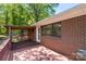Home features a brick exterior, large deck with a covered seating area for outdoor living at 319 Hatley Ne Cir, Concord, NC 28025