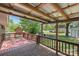 This backyard features a covered deck area, wood railing, and fenced yard at 319 Hatley Ne Cir, Concord, NC 28025