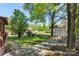 View of a spacious backyard with mature trees, shed and a storage building at 319 Hatley Ne Cir, Concord, NC 28025
