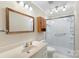The bathroom features a vanity, medicine cabinet, and updated shower and shower door at 319 Hatley Ne Cir, Concord, NC 28025