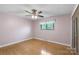 The spacious bedroom includes hardwood floors, neutral paint, and a window at 319 Hatley Ne Cir, Concord, NC 28025