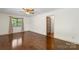 Spacious bedroom with hardwood floors, a ceiling fan, and ample natural light, creating a comfortable and airy atmosphere at 319 Hatley Ne Cir, Concord, NC 28025