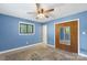 Cozy bedroom with natural light, wood closet doors, and hardwood floors at 319 Hatley Ne Cir, Concord, NC 28025