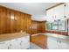 Open kitchen with white cabinets, wooden countertops and trim, and a dining area beyond at 319 Hatley Ne Cir, Concord, NC 28025