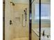 Updated bathroom with glass enclosed shower, granite counters, and tile surround at 324 Quinby Way, Rock Hill, SC 29732