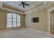 This bedroom has recessed lighting, crown moulding, and a large arched window at 324 Quinby Way, Rock Hill, SC 29732